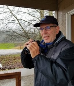 Robert Vanderkamp birds with binoculars from the River S Contact Station